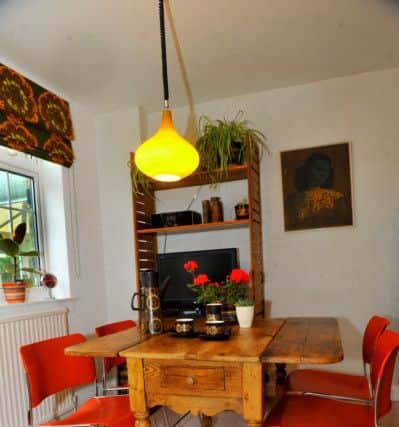 The  kitchen table is vintage and the bright orange 40/4 chairs were designed by David Rowland and feature in the MOMA in New York.
Victoria bought them from a used office furniture supplier in Cleckheaton, which got them from a police station in Leeds.