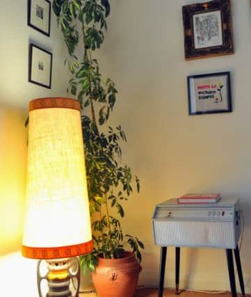 The 1970s lamp looks perfect next to Victoria's original Dansette record player.