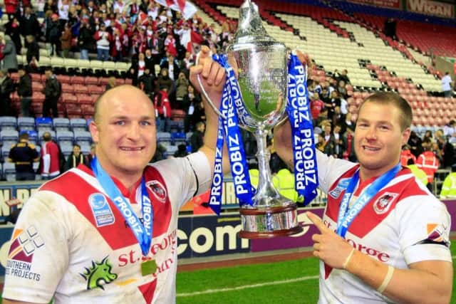 St George Illawarra's Michael Weyman and Trent Merrin, right, with the World Club Challenge Trophy in 2011.