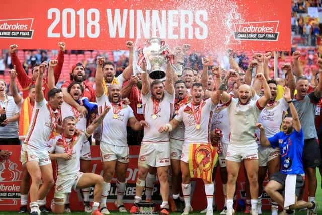 Catalan Dragons' celebrate winning the Ladbrokes Challenge Cup Final at Wembley in August. Picture: Adam Davy/PA