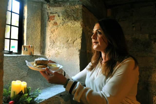 Karla Simpson, of the Treasurers House, York, with Christmas pudding scones, which will be tempting visitors this year.