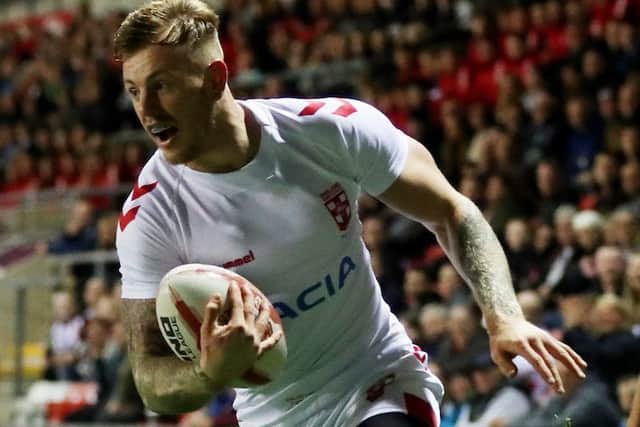 Tom Johnstone scores for England against France.