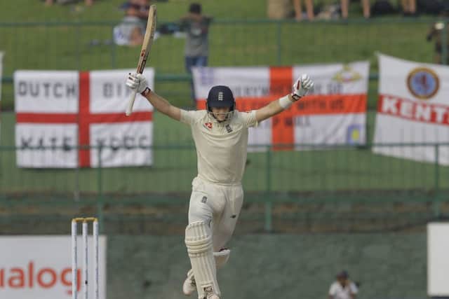 England's Joe Root celebrates as he takes a run to complete a century during the third day in Pallekele. Picture: AP/Eranga Jayawardena