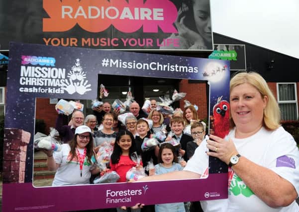 Mission Christmas Appeal at Radio Aire, Leeds. Lisa Sullivan is pictured parents and children helping with the appeal..17th November 2018 ..Picture by Simon Hulme
