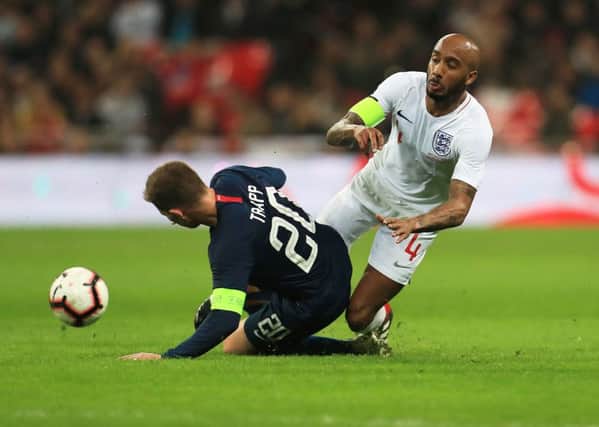 USA's Wil Trapp (left) and England's Fabian Delph battle for the ball (Picture: Mike Egerton/PA Wire)