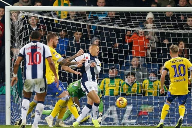 West Bromwich Albion's Dwight Gayle (centre) scores his side's fourth goal against Leeds United.
