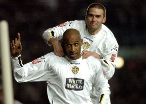 Brian Deane celebrates his fourth goal against QPR in 2004 with David Healy.