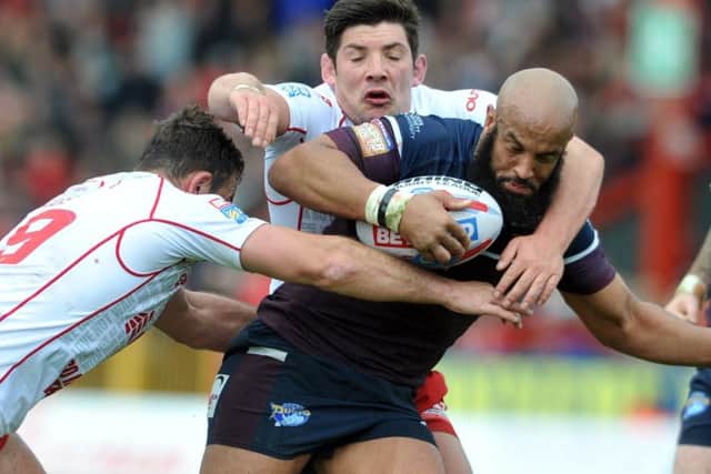 Jamie Jones-Buchanan in typically robust action against Hull KR earlier this year. PIC: Tony Johnson