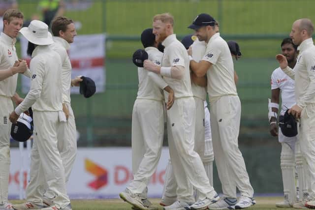 Series clinched: England's players celebrate their victory.