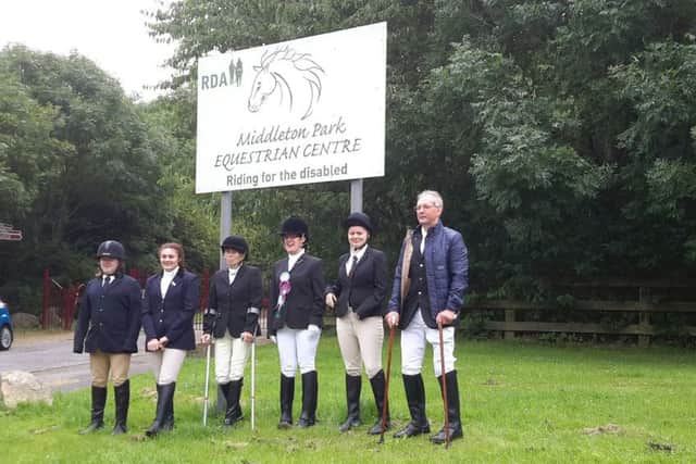 Riders outside Middleton Park Equestrian Centre Riding for the disabled.