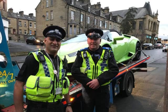 West Yorkshire Police officers with the recovered Lamborghini