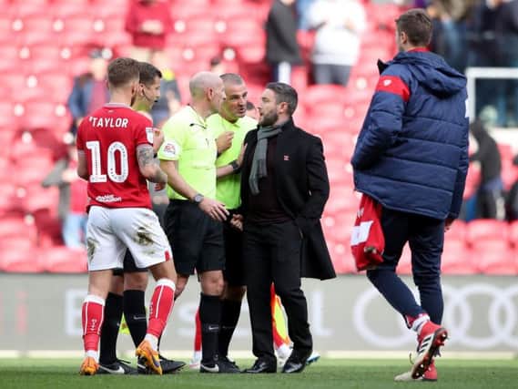 NOT TAKEN LIGHTLY: Bristol City manager Lee Johnson (second right) complains to the match officials after the Sky Bet Championship match at Ashton Gate against Sheffield Wednesday.
