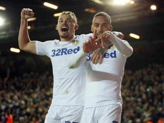 Leeds United's Kemar Roofe (R) and Kalvin Phillips celebrate against Bristol City at Elland Road.
