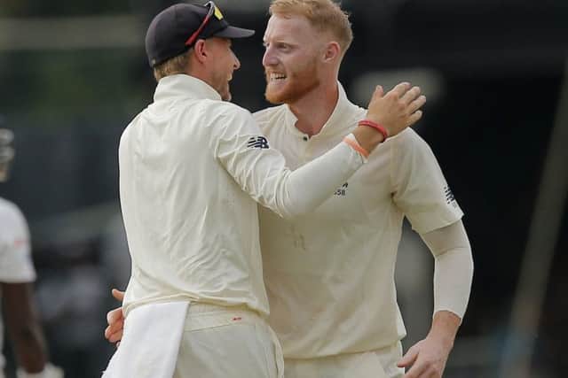 Ben Stokes is congratulated by England captain Joe Root.