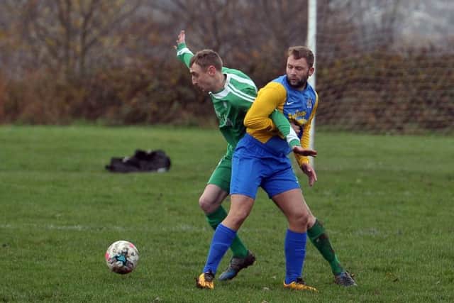 Main Line's Steve Flemming grapples with Hope's Kingsley Wetherald. PIC: Tony Johnson