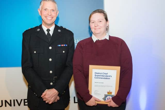 Chf Supt Steve Cotter presents Rachael Lancaster with her certificate.