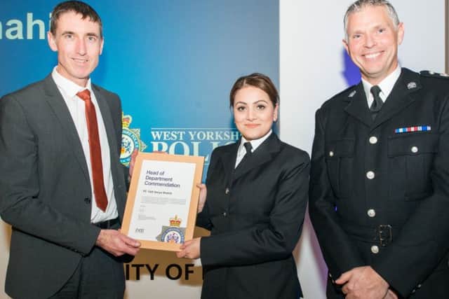 Det Chf Insp Richard Crinnion presents Sanya Shahid with her certificate during the Leeds District Awards 2018 as Chief Supt Steve Cotter looks on. Pictures: Ben Wheeler, West Yorkshire Police.