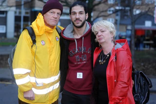 Hossein Ahmadi pictured with his foster parents Steve Johnston and Sally Kincaid.