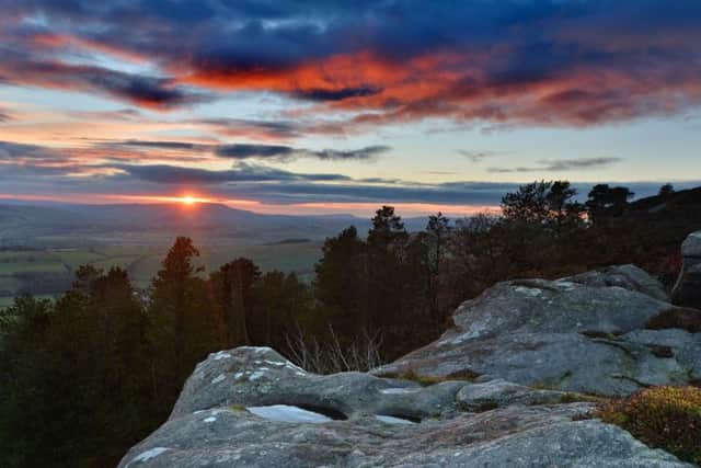 Winter sun sets above Pendle Hill and the Aire Valley from Crookrise Crag. Picture by Bruce Rollinson.