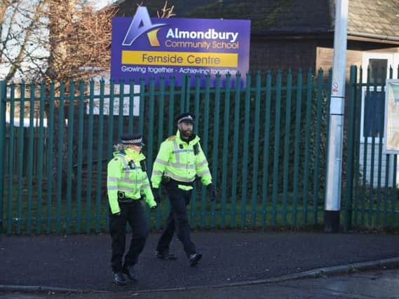 Police outside Almondbury Community School. Picture: PA/Danny Lawson
