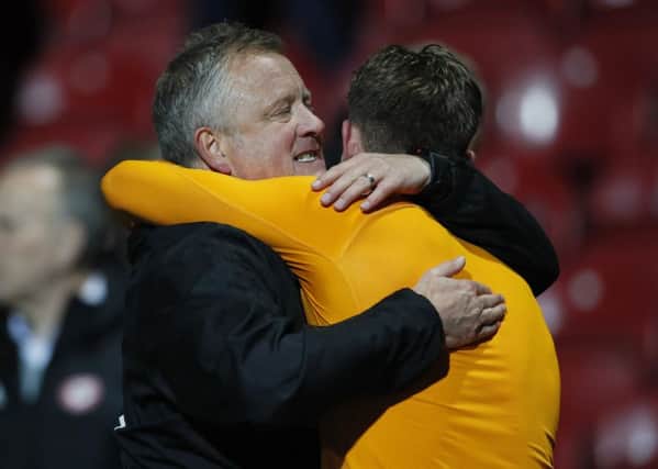 Celebration: Blades chief Chris Wilder hugs Dean Henderson after victory at Brentford. Picture: David Klein/Sportimage