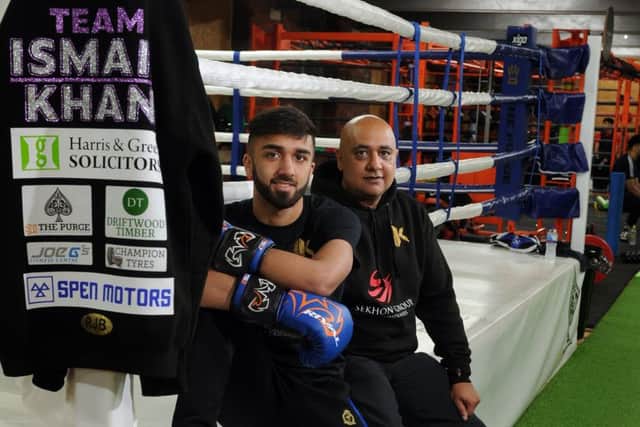 Ismail Khan with his dad Rash Kahn at Purge Boxing Academy in Batley. Picture: Tony Johnson.