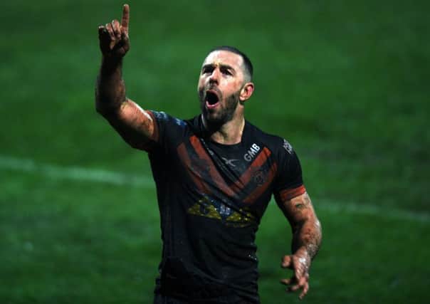 I can be No 1: Luke Gale celebrates with the Castleford Tigers fans after their victory at Wakefield on a wet night in March. But a knee injury he left to fester disrupted his season as a whole (
Picture: Jonathan Gawthorpe)