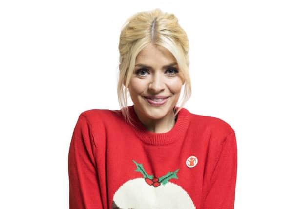 Holly Willoughby wears a Christmas jumper to support Save the Children's Christmas Jumper Day on December 14.