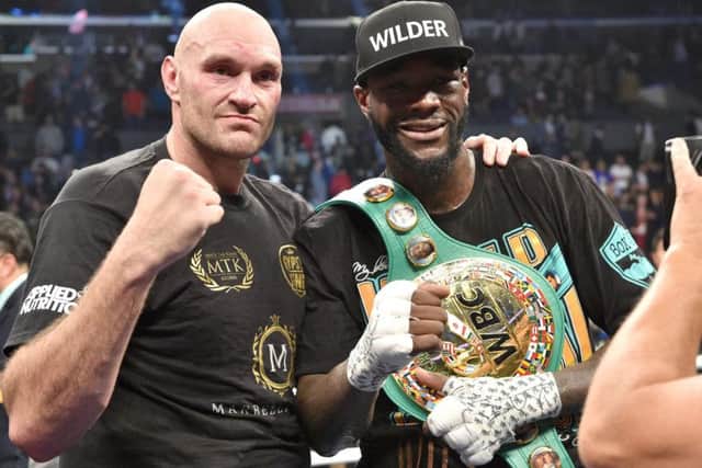 Best of enemies: Deontay Wilder and Tyson Fury after the fight.