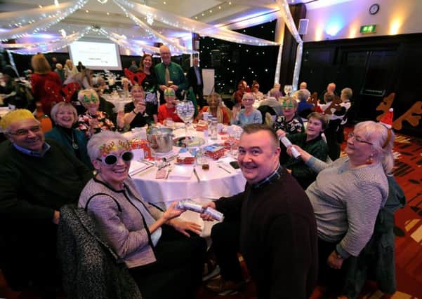 Mike Day is pictured with guests at the Christmas lunch. Picture by Simon Hulme