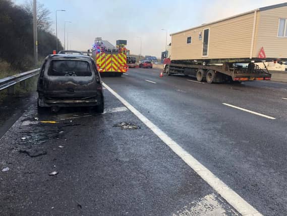 A mum and baby were rescued from a car fire. Photo: Motorway Bob/Twitter