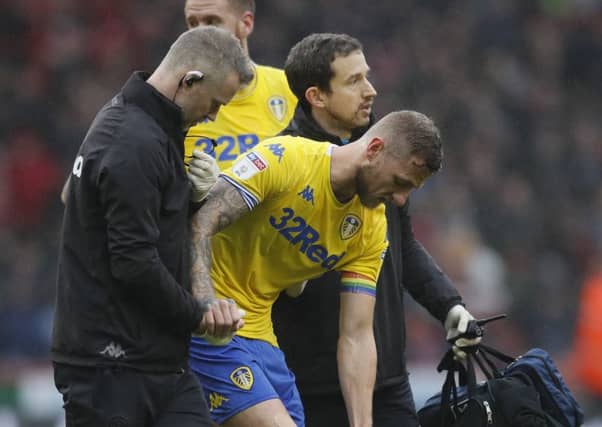 Liam Cooper limps off against Sheffield United.