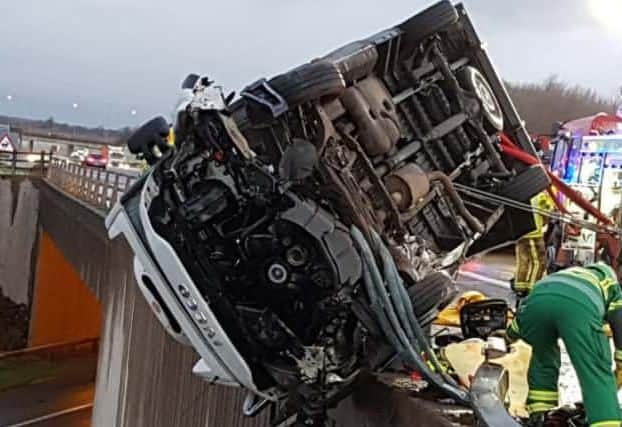 Mr Dulson's van overturned Iveco van hanging on a bridge at junction 44 near Bramham, above the A64 motorway.