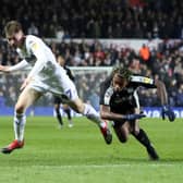 Leeds United's Jack Clarke and Reading's Leandro Bacuna battle for the ball.