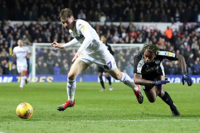 Leeds United's Jack Clarke and Reading's Leandro Bacuna battle for the ball.