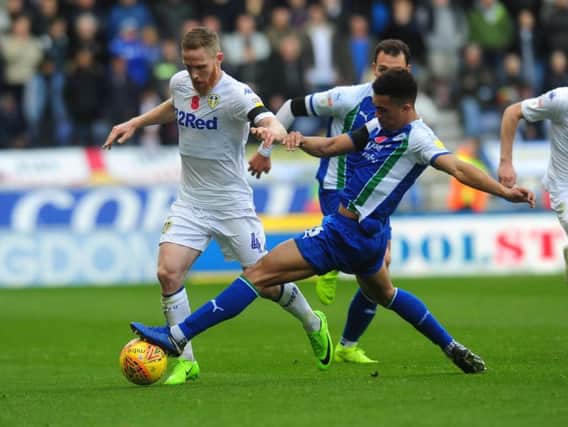 Leeds United midfielder Adam Forshaw in action against Wigan Athletic.