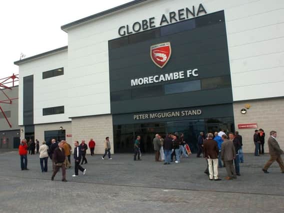 A football fan was injured in a clash with police at Halifax Town's match with Morecambe FC