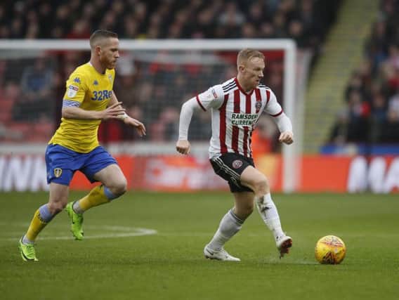 RESPECTFUL: Leeds United midfielder Adam Forshaw, left, in last weekend's 1-0 win at Sheffield United. Picture by Simon Hulme.