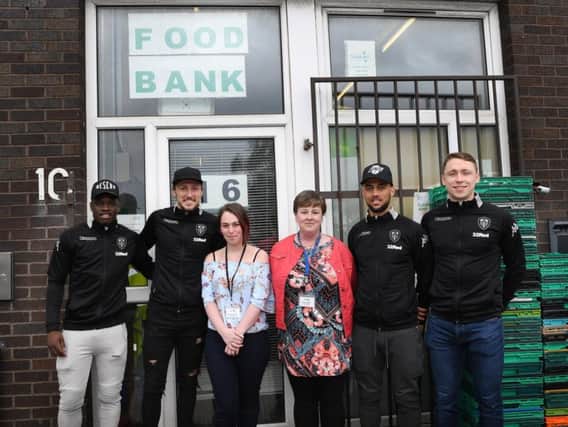 Leeds United players deliver food to the Leeds Food Bank Warehouse in Beeston.
From left, Ronaldo Vieira, Luke Ayling, Amie Thompson, Wendy Doyle, Kemar Roofe, Matthew Pennington.