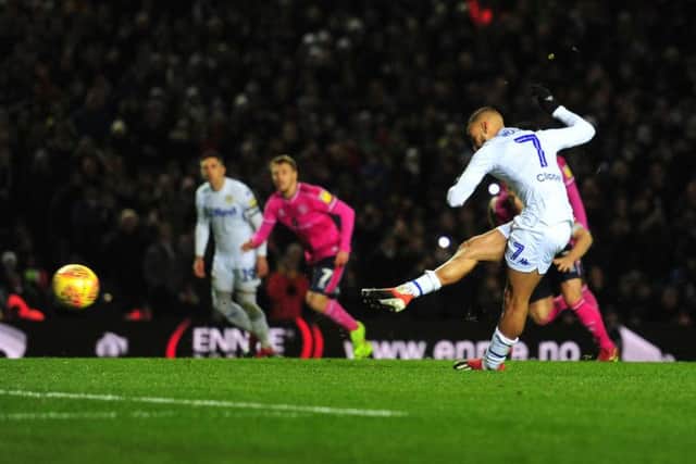 Leeds United's Kemar Roofe slots home a penalty against Queens Park Rangers - the club's first in 59 matches.