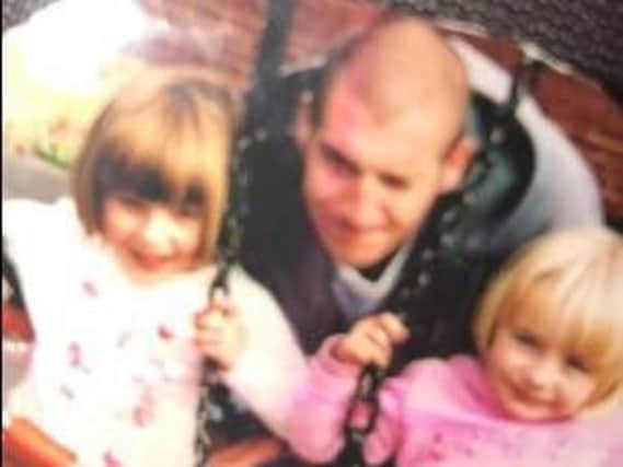 Lee pictured with Nicola's daughters, Megan and Leanne, in a park in Beeston around six years ago