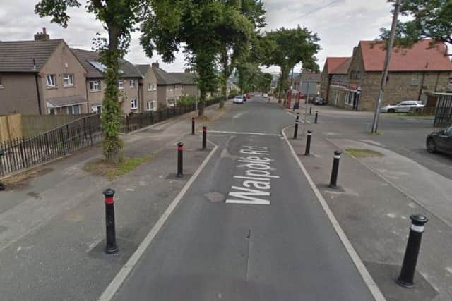 The man was shot in Walpole Road, Huddersfield