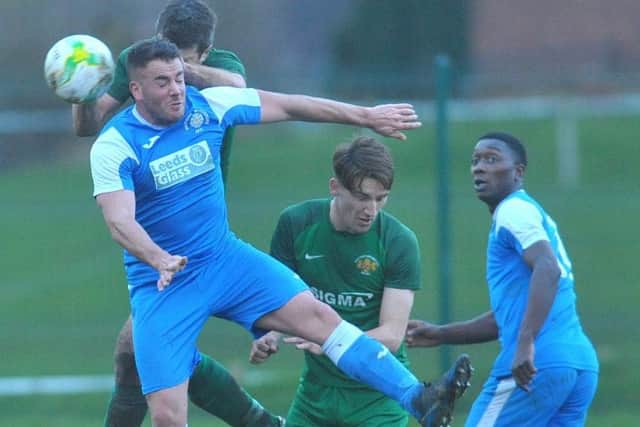Chris Pacevitc,h of Whitkirk, duels with Joe Rossiter, of Beeston St Anthony's. PIC: Steve Riding