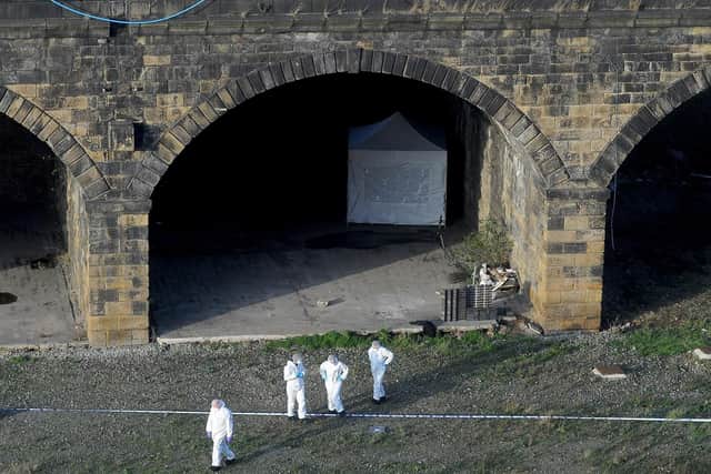 The scene following the discovery of a mans body under disused railway arches off Whitehall Road in Leeds city centre. PIC: Simon Hulme