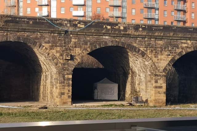 The forensic tent under the arches off Whitehall Road