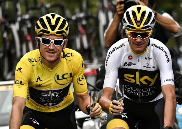 Tour de France legacy: Britain's Geraint Thomas, left, wearing the overall leader's yellow jersey and Britain's Chris Froome hold a glass of Champagne during the 21st and last stage of the 105th edition of the Tour de France. (Marco Bertorello, Pool via AP)