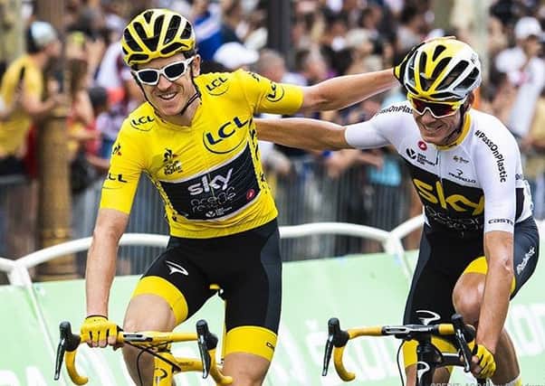Geraint Thomas celebrates  with team mate Chris Froome on the Tour de France.