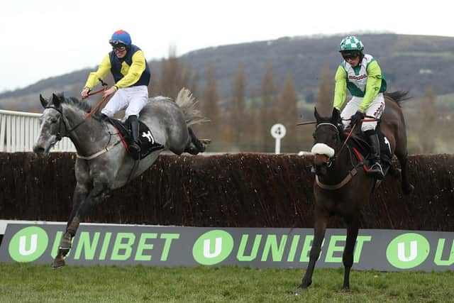 Guitar Pete (left) ridden by Ryan Day jumps the last to win the Caspian Caviar Gold Cup Handicap Steeple Chase at Cheltenham last December . PIC: Adam Davy/PA Wire
