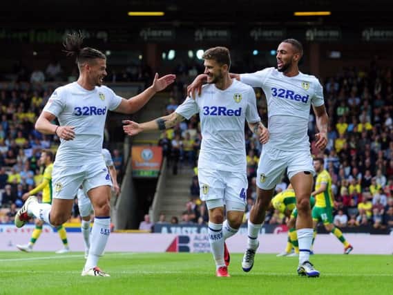 CHIRPY: Mateusz Klich, centre, celebrates his strike in Leeds United's 3-0 win at Norwich City back in August. Picture by Simon Hulme.