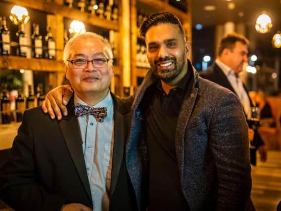 Left: Zack Issak, owner of Estabulo Rodizio Bar & Grill with Michael Chow, right.